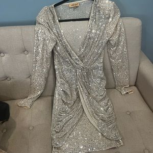 Silver sequin dress! Padded shoulders! Low cut with tighter skirt on bottom